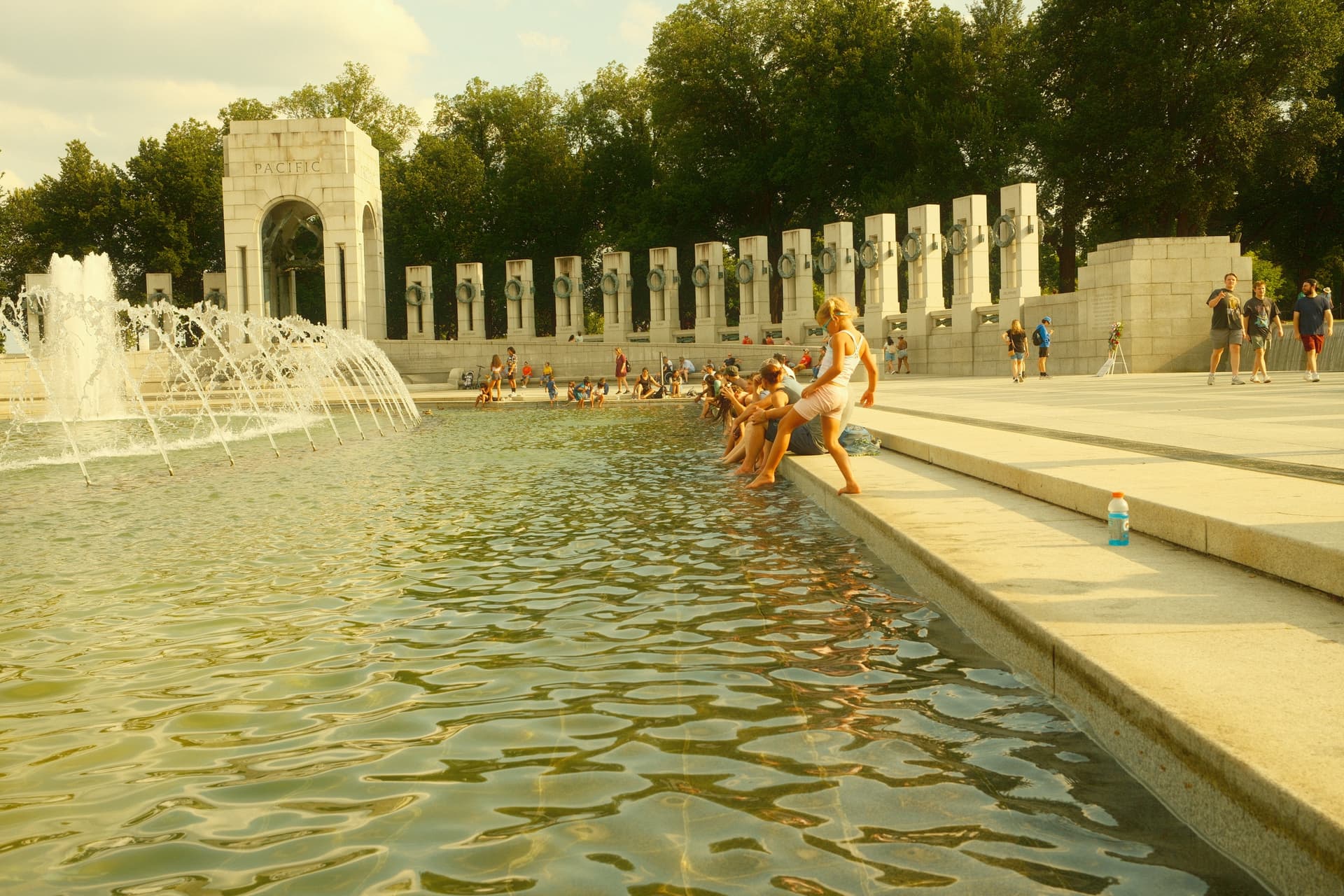 World War II Memorial in Washington DC with children playing by fountain