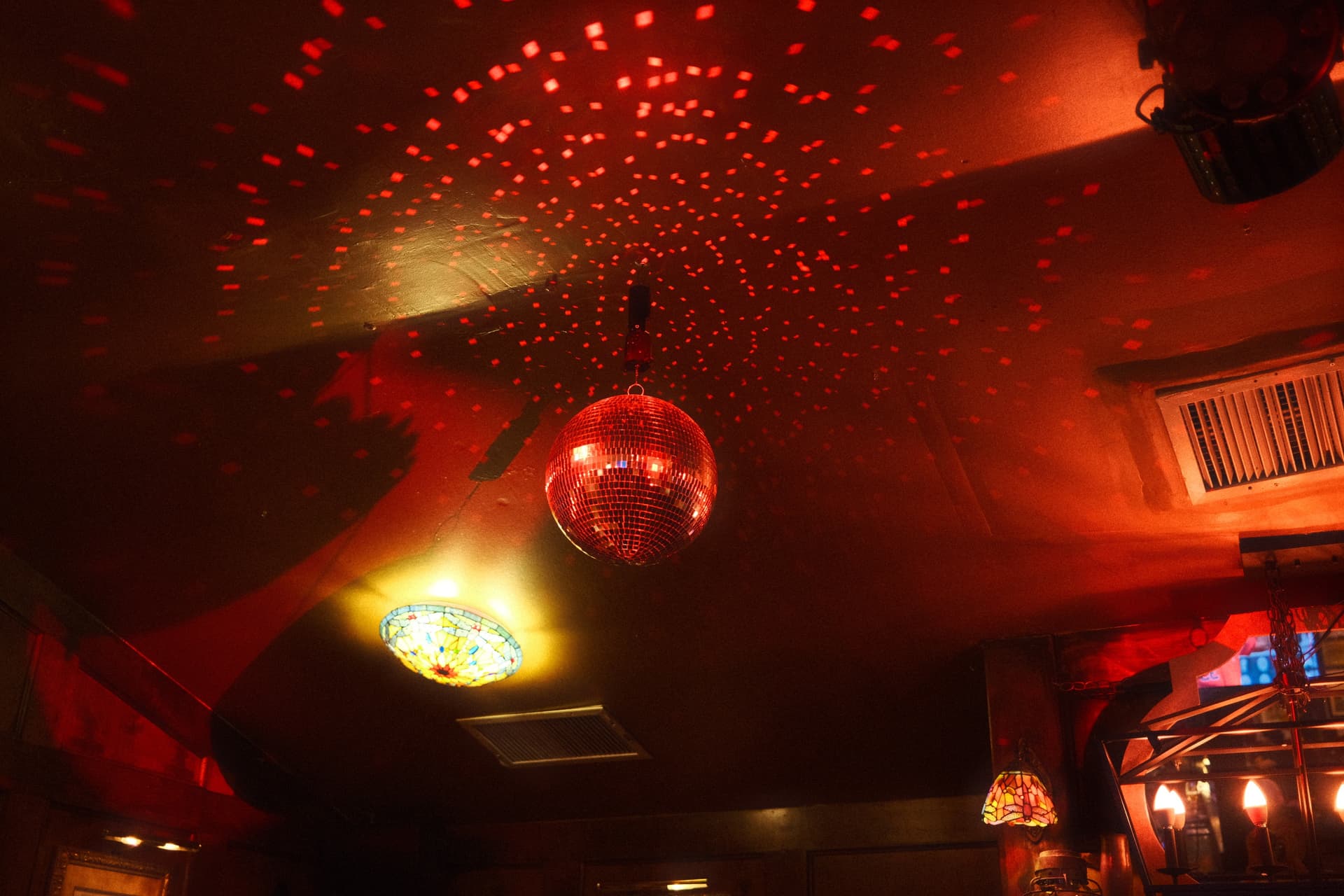 Red disco ball and atmospheric lighting